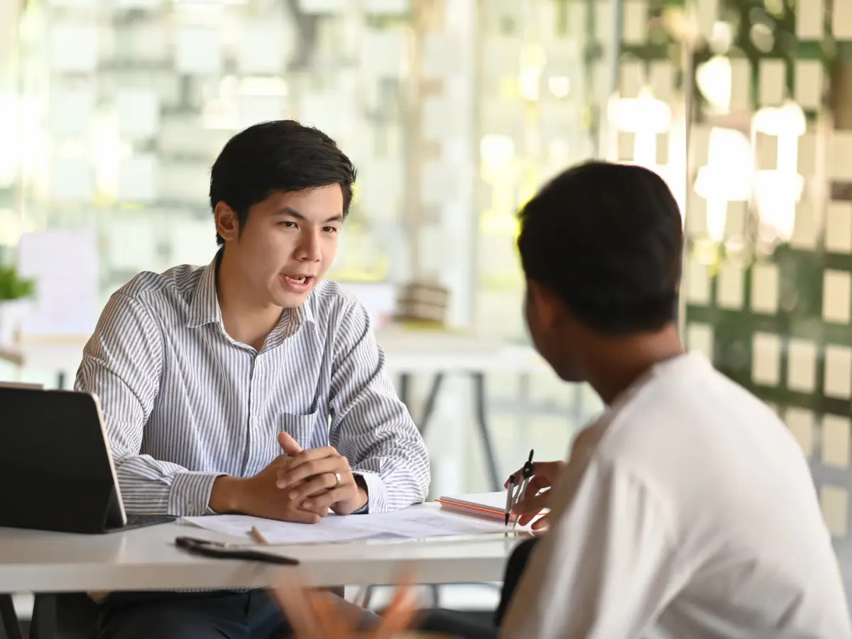 Consultant meeting with a client in a Singapore office